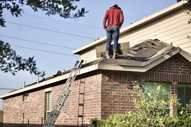 Professional roofer working on a residential roof in North Aurora